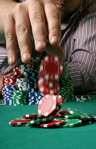 photo: man gambling at casino table