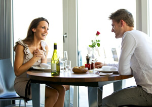 photo: couple having romantic dinner before prenup