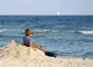 photo: relaxed woman on beach after divorce recovery