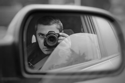 photo of private investigator photographing from car