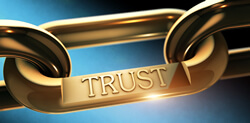 image of gold chain with word trust